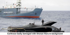 Earthrace badly damaged with shonan Maru in background